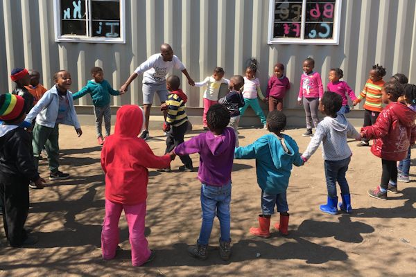 Volunteer with children in South Africa